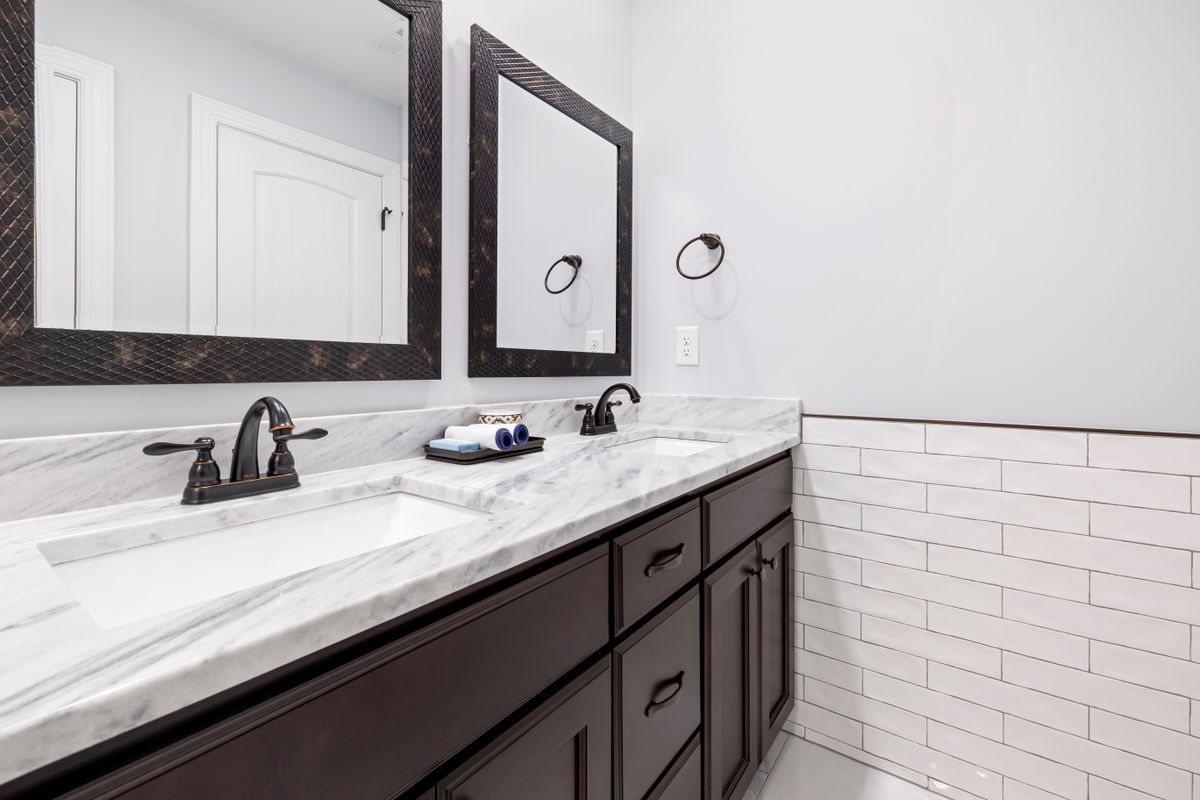 Double-sink bathroom vanity with marble countertop